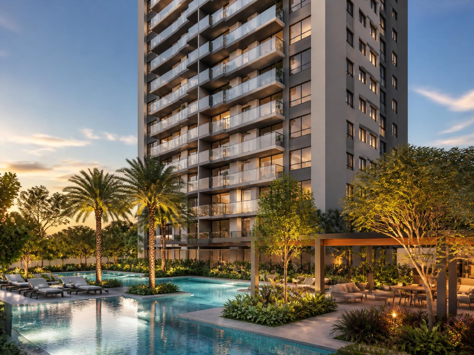 Empreendimento residencial com área de lazer ao entardecer